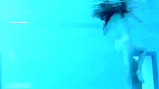 Beautiful Redhead's Playful Charm by the Poolside
