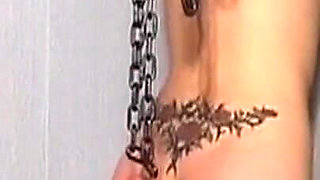 Chained Mature Brunette MILF Flogged by Dominant Master
