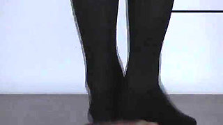 The Slave's Orgasm Under Mistress Cleo's Stocking Feet