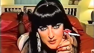 Vintage smoking fetish slut with long red nails & lipstick takes a cumshot