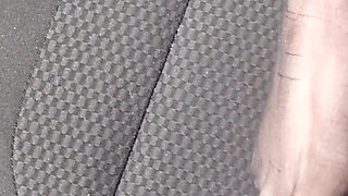 Feet of Nylonjunge in Pantyhose in Car
