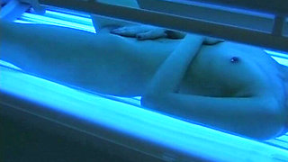 Watch How This German Babe Plays with Her Pussy in Sunbed