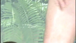 Horny ebony gives a blowjob while second stud fucks her ass
