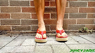 Small Asian Feet in Red Heeled Flip Flops