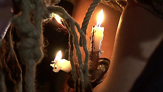 Witch Hangs Upside Down and Gets Drizzled with Black Wax