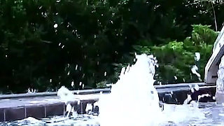 Two horny lesbians masturbate with toys outdoor by the pool