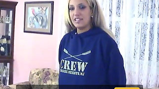 Slutty blonde teen shows off her erotic body on her couch