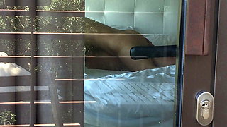 Filming a hot couple fuck while staring through hotel window