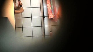 Shower voyeur spies on a sexy amateur babe with a lovely ass