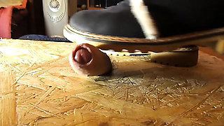 Domina crushes cock with high heels