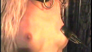 Mature mistress chastises and punishes alluring blonde female parent in BDSM chamber