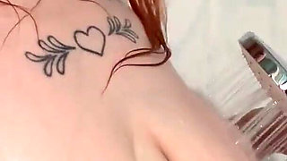 The Redhead Slut Masturbates Her Pussy with the Shower and Enjoys I