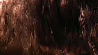 A super sexy brunette massages her big boobs