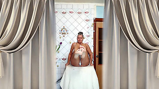 A Mature Ukrainian Woman Shows off Her Figure and Poses for the Camera at Home