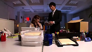 Charming Japanese secretary fucked by two guys in the office