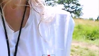 Blonde is flashing her big boobs in the outdoors