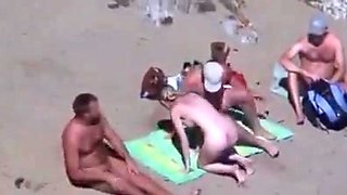 Cuckold couple on the beach