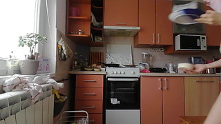 A Sexy Naked Woman Prepares Food in the Kitchen