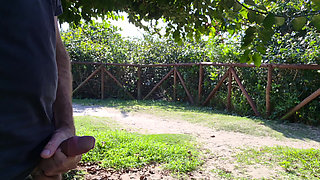 Risky handjob for hot redhead on the walk in the park in public!