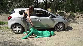 Suited slave gets punished outdoor from femdom chick