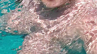 Swimming in the blue waters of Greece butt naked...