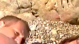 Raquel Abril a cheating whore with brown hair enjoys screaming with pleasure while fucking on a beach