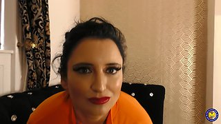 The shapely British MILF, Jasmine De Launay, enjoys displaying her ample backside and large breasts.